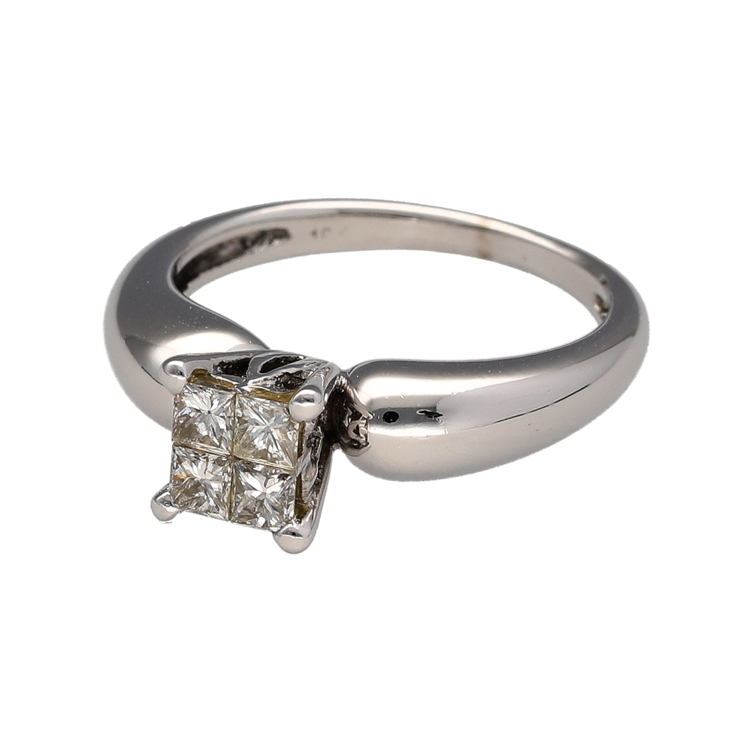 This pre-owned 18ct white gold diamond princess cut illusion solitaire ring is a classic design, featuring multiple princess cut diamonds set together to create the appearance of a larger centre stone.

Design: Featuring an illusion solitaire design, this ring has multiple princess cut diamonds closely set together to create the look of one larger diamond, finished in polished 18ct white gold.
Material: Made from 18-carat white gold.