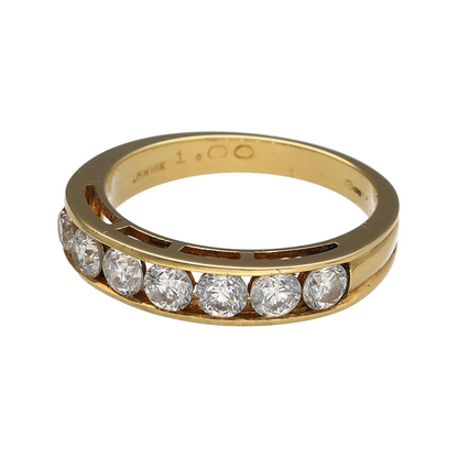 This pre-owned 18ct yellow gold seven stone diamond band ring is a classic design, featuring seven diamonds set across the front with approximately 1ct total diamond content.

Design: Featuring a traditional seven stone design, this ring showcases a row of diamonds across the front of a warm 18ct yellow gold band.
Material: Made from 18-carat yellow gold.
Gemstone Detail: Set with seven diamonds totalling approximately 1ct, with an approximate SI1 clarity and G colour.