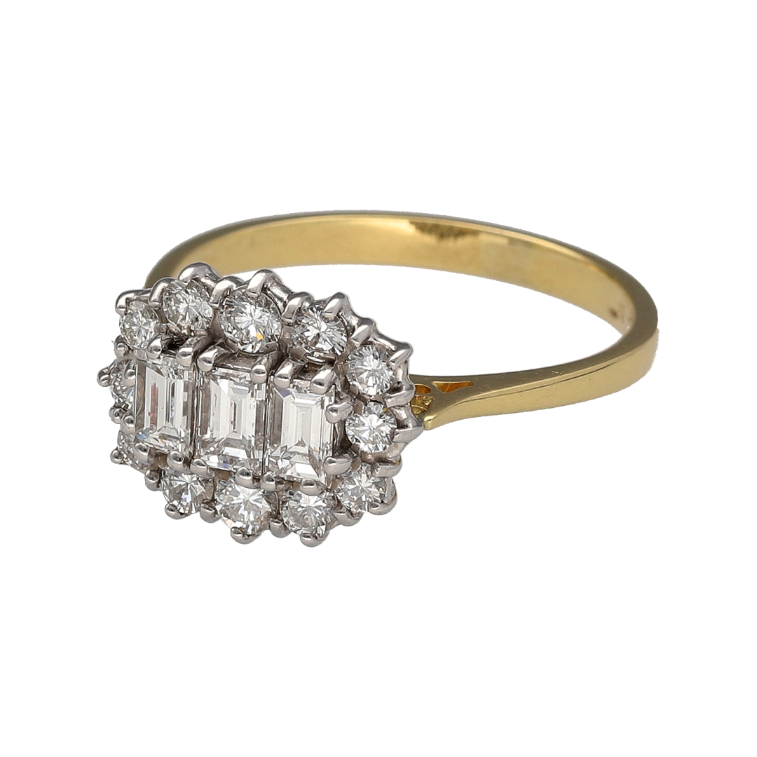 Add an impressive diamond piece to your jewellery collection with this pre-owned 18ct yellow gold cluster ring, featuring emerald-cut and brilliant-cut diamonds with approximately 0.96ct of diamond content in total.

Design: The ring features a distinctive cluster design, with three emerald-cut diamonds forming the centre and brilliant-cut diamonds arranged around them to create a bold and elegant focal point.