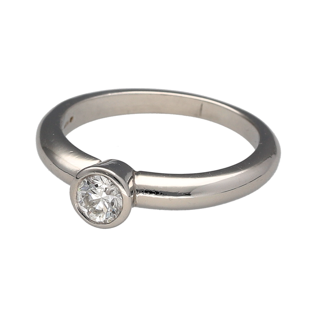 Add a timeless piece to your jewellery collection with this pre-owned platinum and diamond solitaire ring, featuring a brilliant cut diamond in a classic rubover setting.

Design: The ring features a traditional solitaire design, with a brilliant cut diamond held securely in a smooth rubover setting, creating an elegant and understated appearance.
Material: Made from platinum, offering a naturally white finish that complements the diamond.