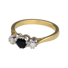Load image into Gallery viewer, Preowned 18ct Yellow and White Gold Diamond &amp; Sapphire Set Trilogy Ring in size N with the weight 4.20 grams. The sapphire stone is 5mm diameter and there is approximately 18pt diamond content in total
