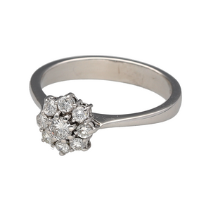 Preowned 18ct White Gold & Diamond Set Flower Cluster Ring in size O with the weight 4.10 grams. There is approximately 34pt of diamond content set in total with approximate clarity Si and colour J - K. The front of the ring is 10mm high