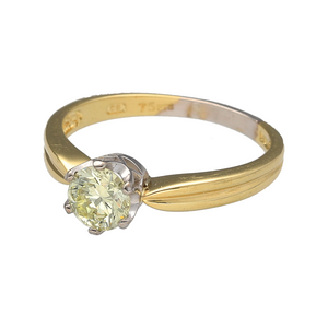 Preowned 18ct Yellow and White Gold & Diamond Set Solitaire Ring in size P with the weight 3.50 grams. The diamond is brilliant cut and is approximately 75pt. The diamond is approximate clarity VS and colour M - P