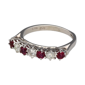 Preowned 18ct White Gold Diamond & Ruby Set Band Ring in size I with the weight 2.50 grams. The ruby stones are each 3mm diameter and there is approximately 0.24ct of diamond content in total with approximate clarity Si