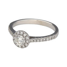 Load image into Gallery viewer, Add a touch of timeless elegance to your jewellery collection with this pre-owned 18ct white gold &amp; diamond set halo ring, featuring:

Design: A stunning halo ring, with a central diamond surrounded by a halo of smaller diamonds for enhanced brilliance.
Material: 18-carat white gold, offering a sleek and luxurious finish.
Gemstones: Features a centre diamond of approximately 0.25ct, with additional diamond-set shoulders for extra sparkle.
Size &amp; Weight: Designed in size K, with a well-balanced weight of 2.5
