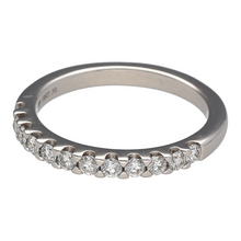 Load image into Gallery viewer, Add a touch of timeless elegance to your jewellery collection with this pre-owned 18ct white gold &amp; diamond set band ring, featuring:

Design: A sleek and sophisticated band ring, adorned with sparkling diamonds for a refined look.
Material: 18-carat white gold, offering a luxurious and modern finish.
Gemstones: Set with approximately 0.50ct of diamond content in total, providing exceptional brilliance.
Size &amp; Weight: Designed in size P, with a well-balanced weight of 4.10 grams for a comfortable fit.
Band 

