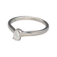 Load image into Gallery viewer, Add a touch of sophistication and brilliance to your jewellery collection with this pre-owned 9ct white gold &amp; diamond set pear cut solitaire ring, featuring:

Design: A timeless pear-cut solitaire ring, offering an elegant and elongated shape that enhances the sparkle of the diamond.
Material: 9-carat white gold, providing a sleek and modern finish.
Gemstone: Features a 0.39ct pear-cut diamond, known for its brilliance and unique shape.

