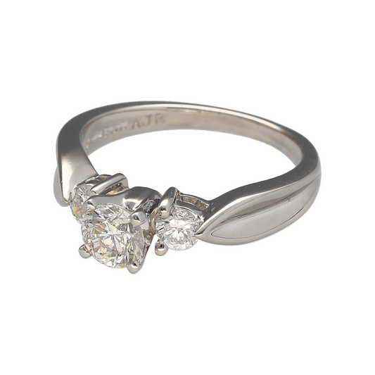 Add a timeless and sophisticated piece to your jewellery collection with this pre-owned platinum & diamond set trilogy ring, featuring:

Design: A classic trilogy ring, symbolising the past, present, and future with its stunning three-diamond setting.
Material: Platinum, known for its durability and luxurious appeal.
Gemstones: Features a brilliant-cut centre diamond of approximately 0.46ct, complemented by two smaller brilliant-cut diamonds of approximately 0.11ct each
