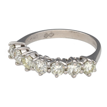Load image into Gallery viewer, Add a touch of brilliance to your jewellery collection with this pre-owned 18ct white gold &amp; diamond set seven-stone band ring, featuring:

Design: A classic seven-stone band, offering timeless elegance and radiant sparkle.
Material: 18-carat white gold, providing a sleek and polished finish.
Gemstone Detail: Set with approximately 1.05ct total diamond content in brilliant-cut diamonds, ensuring dazzling brilliance.
Diamond Quality: Estimated SI1 clarity and K-M colour
