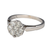 Load image into Gallery viewer, Add a touch of elegance to your jewellery collection with this pre-owned 18ct white gold &amp; diamond set illusion cluster solitaire ring.

Design: A stunning illusion cluster design that creates the appearance of a larger diamond, with a central sparkling solitaire surrounded by smaller diamonds for a captivating look.
Material: Crafted from 18-carat white gold, offering a sleek and polished finish that enhances the brilliance of the diamonds.


