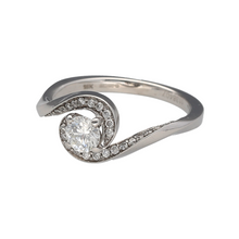 Load image into Gallery viewer, Add refined sparkle to your jewellery collection with this pre-owned 18ct white gold and diamond set twist band solitaire ring, featuring:

Design: A modern twist band design with a raised solitaire setting, elegantly accented by smaller diamonds along the band.
Material: 18-carat white gold, offering a sleek, polished finish that enhances the brilliance of the diamonds.
Gemstone Detail: Features a Canadian brilliant-cut centre diamond of approximately 0.44ct, with SI clarity and G–J colour
