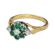 Load image into Gallery viewer, Bring classic elegance and vibrant colour to your collection with this pre-owned 18ct yellow gold diamond and emerald flower cluster ring, featuring:

Design: A refined floral cluster design with vivid emeralds forming the petals, centred around a sparkling diamond for a graceful and timeless finish.
Material: 18-carat yellow gold, offering a rich, luxurious tone with a highly polished finish that enhances the brilliance of the stones.

