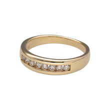 Load image into Gallery viewer, Add luxurious sparkle and timeless style to your collection with this pre-owned 9ct yellow gold diamond set band ring, featuring:

Design: A bold and beautifully polished band set with a generous spread of diamonds across the front, offering both brilliance and presence.
Material: 9-carat yellow gold, with a smooth, high-shine finish that perfectly complements the shimmer of the diamonds.
Gemstone Detail: Set with approximately 0.50ct total of sparkling diamonds, adding refined glamour to this classic band 
