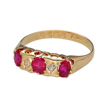 Load image into Gallery viewer, Step back in time with this pre-owned 18ct yellow gold diamond and ruby set vintage ring, dating to circa 1915. With its timeless elegance and historical charm, this piece is a beautiful testament to early 20th-century design, featuring:

Design: A graceful vintage setting with three oval-cut rubies at its heart, framed by delicate diamond accents, embodying the refined style of the Edwardian era.
Material: Made from 18-carat yellow gold
