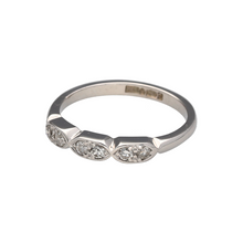 Load image into Gallery viewer, Bring subtle sparkle and modern design to your collection with this pre-owned platinum and diamond set band ring, featuring a unique layout of shaped sections with refined detailing—perfect for everyday elegance or special occasions.

Design: The front of the band features three softly shaped sections, each set with two brilliant-cut diamonds, creating a balanced and contemporary look with delicate shimmer.

