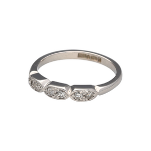 Bring subtle sparkle and modern design to your collection with this pre-owned platinum and diamond set band ring, featuring a unique layout of shaped sections with refined detailing—perfect for everyday elegance or special occasions.

Design: The front of the band features three softly shaped sections, each set with two brilliant-cut diamonds, creating a balanced and contemporary look with delicate shimmer.
