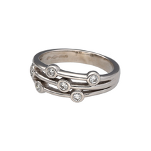 Load image into Gallery viewer, Bring modern sparkle and bold texture to your collection with this pre-owned platinum and diamond set bubble band ring, featuring a contemporary multi-band design with scattered brilliance—perfect for statement styling or refined everyday wear.

Design: The ring showcases a 7mm wide bubble-style front made up of three split bands, accented with seven scattered diamonds for a playful yet elegant effect.

