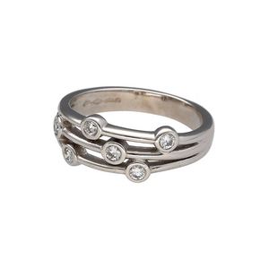 Bring modern sparkle and bold texture to your collection with this pre-owned platinum and diamond set bubble band ring, featuring a contemporary multi-band design with scattered brilliance—perfect for statement styling or refined everyday wear.

Design: The ring showcases a 7mm wide bubble-style front made up of three split bands, accented with seven scattered diamonds for a playful yet elegant effect.

