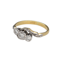 Load image into Gallery viewer, Bring graceful movement and meaningful sparkle to your collection with this pre-owned 18ct yellow gold and platinum diamond set trilogy twist ring, featuring elegant detail and symbolic design—perfect for marking special moments or everyday elegance.

Design: The ring features a trilogy of diamonds set in a soft twist design, with platinum settings enhancing the brilliance of each stone and symbolising the past, present, and future.

