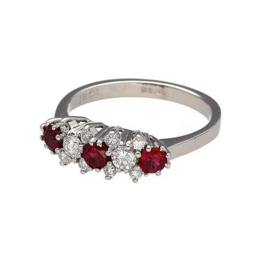 Bring rich colour and elegant sparkle to your collection with this pre-owned 18ct white gold diamond and ruby set cluster style band ring, blending classic design with vibrant detail—perfect for special occasions or timeless everyday wear.

Design: The ring features three vivid round ruby stones, each 3.5mm in diameter, interspaced with ten brilliant-cut diamonds in a cluster style setting for a beautifully balanced and luxurious look.