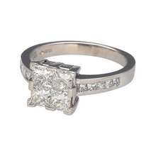Load image into Gallery viewer, Bring bold brilliance and modern sophistication to your collection with this pre-owned platinum diamond illusion set solitaire ring, offering the look of a single large stone with expertly arranged diamonds—perfect for standout elegance or a remarkable engagement ring.

Design: The centre features four interlocking princess-cut diamonds, illusion set to create the appearance of a single large stone, totalling approximately 1.24ct. 
