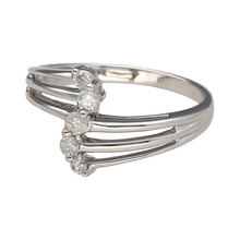 Load image into Gallery viewer, Bring contemporary elegance and graceful sparkle to your collection with this pre-owned 18ct white gold diamond set split band ring, featuring a flowing design with brilliant detail—perfect for standout style or meaningful gifting.

Design: The ring showcases a gently curved front with five brilliant-cut diamonds arranged in a sweeping line across a split band, totalling approximately 0.25 carats, offering a modern twist on a classic five-stone setting.

