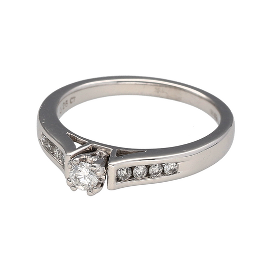 Bring classic sophistication and timeless sparkle to your collection with this pre-owned 18ct white gold diamond set solitaire ring, featuring a refined design with elegant detail—perfect for engagements or meaningful celebrations.

Design: The ring showcases a central brilliant-cut diamond of approximately 0.25ct, complemented by additional diamonds set along the shoulders for added sparkle and graceful symmetry.
