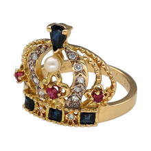 Load image into Gallery viewer, Bring regal charm and rich colour to your collection with this pre-owned 18ct gold crown ring, set with diamonds, rubies, sapphires, and pearls for a bold and opulent look—perfect for statement wear or a truly special gift.

Design: The front of the ring features an ornate crown design standing 2cm high, set with a striking combination of diamonds, rubies, sapphires, and a pearl arranged to reflect royal elegance and colourful brilliance.

