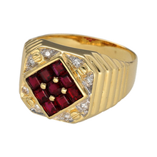 Load image into Gallery viewer, Make a bold and luxurious statement with this pre-owned 18ct yellow gold diamond and ruby signet ring—rich in colour, weight, and timeless design.

Design: The ring features a striking 14mm high front with nine square-cut rubies set in a bold grid pattern at the centre, framed by glittering diamonds for added brilliance and depth.
Material: Made from 18-carat yellow gold, the rich golden tone enhances the deep red of the rubies and the sparkle of the diamonds, creating a powerful and refined look.


