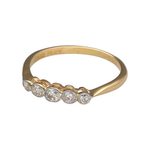 Load image into Gallery viewer, Bring classic elegance and subtle sparkle to your jewellery collection with this pre-owned 18ct yellow gold and platinum five stone diamond band ring—a refined design with timeless appeal.

Design: This traditional band features five round-cut diamonds set evenly across the top, offering a balanced and graceful look with subtle brilliance.
Material: Made from 18-carat yellow gold with platinum settings, the combination of metals enhances the clarity of the diamonds while providing durability and contrast.
