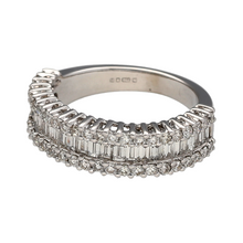 Load image into Gallery viewer, Bring structured sparkle and modern elegance to your collection with this pre-owned 18ct white gold band ring, featuring a sophisticated combination of brilliant and baguette-cut diamonds—perfect for everyday luxury or a refined occasion piece.

Design: The front of the band measures 5mm wide and showcases two rows of small brilliant-cut diamonds, with baguette-cut diamonds set in between. The geometric arrangement adds texture and depth.

