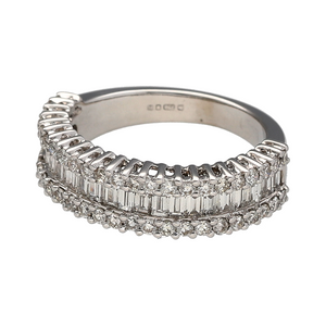 Bring structured sparkle and modern elegance to your collection with this pre-owned 18ct white gold band ring, featuring a sophisticated combination of brilliant and baguette-cut diamonds—perfect for everyday luxury or a refined occasion piece.

Design: The front of the band measures 5mm wide and showcases two rows of small brilliant-cut diamonds, with baguette-cut diamonds set in between. The geometric arrangement adds texture and depth.
