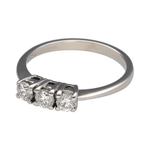 Load image into Gallery viewer, Celebrate your past, present, and future with this pre-owned 18ct white gold diamond set trilogy ring—a timeless and symbolic design with elegant brilliance.

Design: The ring features three brilliant-cut diamonds, totalling approximately 0.50ct, arranged in a classic trilogy setting that represents life’s most meaningful moments.
Material: Made from 18-carat white gold, the polished finish enhances the sparkle of the stones and offers a sleek, refined backdrop.

