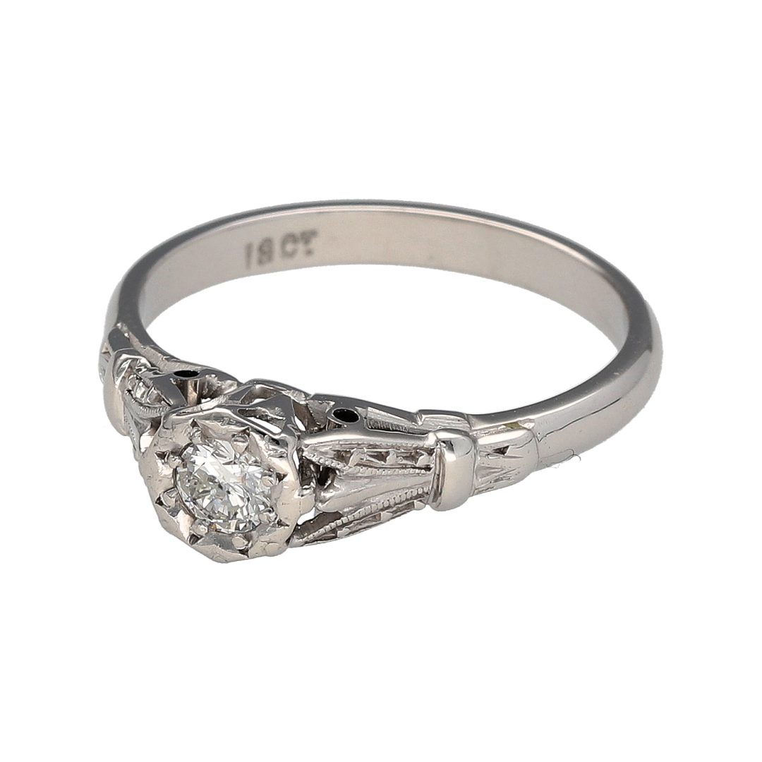 Bring timeless sparkle and vintage-inspired elegance to your collection with this pre-owned 18ct white gold and diamond set solitaire ring, offering a refined blend of classic design and romantic detail—perfect for marking life’s special moments.

Design: The ring features a brilliant cut diamond of approximately 0.20ct, showcased in an elegant solitaire setting with vintage-style detailing that adds character and sophistication.
