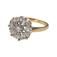Load image into Gallery viewer, Add vintage-inspired elegance and floral sparkle to your jewellery collection with this pre-owned 18ct yellow and white gold diamond cluster ring.

Design: The front of the ring measures 12mm high and features a white gold flower-shaped cluster, set with round diamonds that radiate classic brilliance and charm.
Material: Made from 18-carat yellow gold with a white gold setting, the dual-tone design enhances the contrast between the warm band and bright diamonds.

