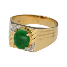 Load image into Gallery viewer, Bring bold colour and classic design to your jewellery collection with this pre-owned 18ct yellow gold signet ring, featuring a vivid emerald and accent diamonds—perfect for refined everyday wear or meaningful gifting.

Design: The ring features a 9mm by 7mm oval-cut emerald at the centre, accented with diamonds that highlight the signet-style setting for a striking yet balanced look.

