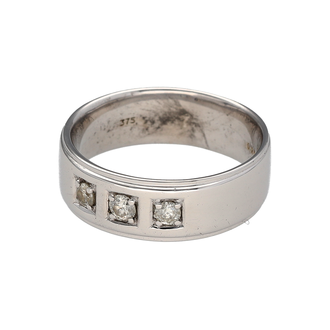 Bring contemporary elegance and refined sparkle to your collection with this pre-owned 9ct white gold diamond set band ring—perfect for both everyday wear and special occasions.

Design: The ring features a 7mm wide band adorned with three diamonds, offering a balanced and sophisticated touch of brilliance.
Material: Made from 9-carat white gold, the polished finish enhances the bright tone of the metal and the sparkle of the diamonds.

