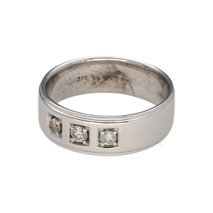 Bring contemporary elegance and refined sparkle to your collection with this pre-owned 9ct white gold diamond set band ring—perfect for both everyday wear and special occasions.

Design: The ring features a 7mm wide band adorned with three diamonds, offering a balanced and sophisticated touch of brilliance.
Material: Made from 9-carat white gold, the polished finish enhances the bright tone of the metal and the sparkle of the diamonds.
