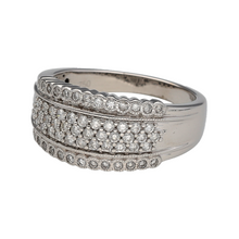 Load image into Gallery viewer, Add bold sparkle to your collection with this pre-owned 18ct white gold diamond wide band ring, a statement piece with timeless elegance.

Design: The ring features a 10mm wide band, set with diamonds across the front for a striking and radiant look.
Material: Made in 18-carat white gold, the polished finish provides a sleek backdrop that enhances the brilliance of the diamonds.
Ring Detail: Holding approximately 0.60ct of total diamond content, this wide band design offers refined sparkle and modern style.
