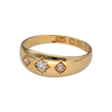 Load image into Gallery viewer, Bring vintage charm and sparkle to your collection with this pre-owned 18ct yellow gold diamond trilogy band ring, styled with a starburst setting for timeless appeal.

Design: The ring features three diamonds in a classic trilogy arrangement, each set within a starburst engraving across the 7mm wide band for a distinctive vintage look.
Material: Made in 18-carat yellow gold, the polished finish adds warmth and highlights the engraved detailing.
