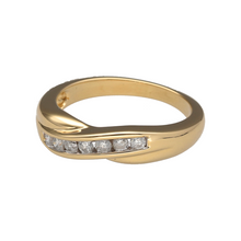 Load image into Gallery viewer, Add timeless elegance to your collection with this pre-owned 18ct yellow gold diamond crossover band ring, a graceful design with refined sparkle.

Design: The ring features a 5mm wide crossover band, accented with diamonds that flow across the front for a stylish and sophisticated look.
Material: Made in 18-carat yellow gold, the polished finish enhances the warmth of the gold and the brilliance of the diamonds.
