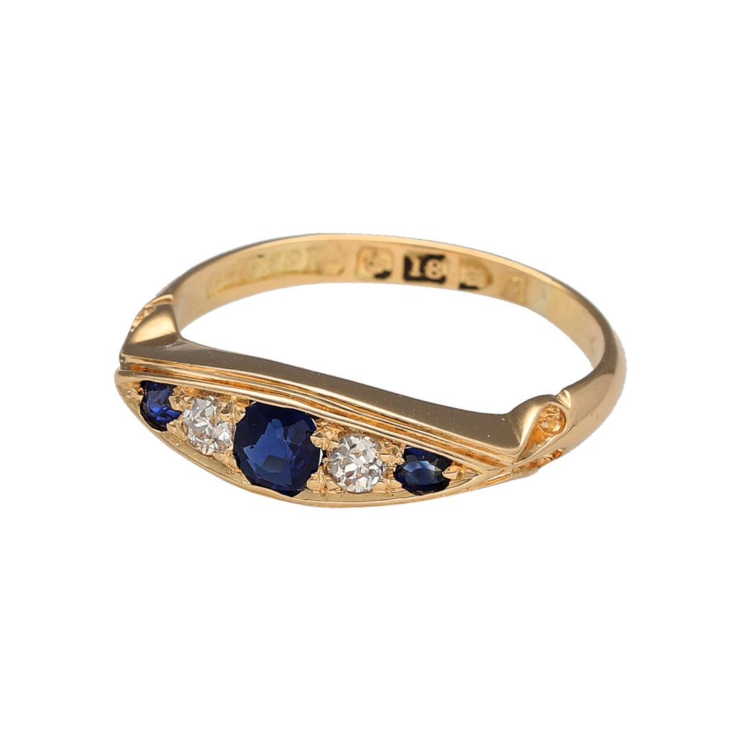 Bring antique charm and timeless beauty to your collection with this pre-owned 18ct yellow gold diamond and sapphire set vintage Edwardian-style boat ring—a stunning piece of early 20th-century craftsmanship and elegance.

Design: The ring features a classic boat-shaped setting with a 4mm round sapphire at the centre, flanked by sparkling diamonds that enhance the deep blue hue of the gemstone. The elegant design reflects the refined detailing of the Edwardian era.