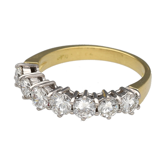 Bring impressive brilliance and timeless luxury to your jewellery collection with this pre-owned 18ct yellow gold & diamond set seven stone band ring, offering exceptional sparkle and classic elegance.

Design: The ring features seven diamonds arranged in a continuous row across the band, creating a striking and balanced design that delivers maximum brilliance from every angle.