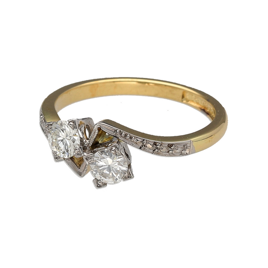 Bring elegant contrast and refined sparkle to your jewellery collection with this pre-owned 18ct yellow gold and platinum diamond set twist ring, a beautifully balanced design with timeless appeal.

Design: The ring features a graceful twist-style design set with two princess-cut diamonds, each approximately 0.25ct, creating a striking and symmetrical focal point.