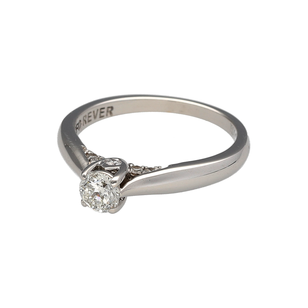 Add timeless elegance and refined sparkle to your jewellery collection with this pre-owned 18ct white gold diamond solitaire ring, offering classic beauty with a subtle modern detail.

Design: This solitaire ring features a brilliant cut diamond measuring approximately 0.25ct, with an estimated clarity of VS2, creating a bright and eye-catching focal point. Beneath the main stone sits a hidden row of diamonds, adding extra sparkle from every angle.