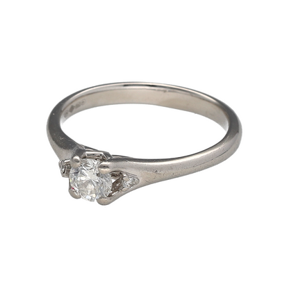 Add timeless elegance and refined sparkle to your jewellery collection with this pre-owned platinum diamond solitaire ring, offering classic design with subtle added brilliance.

Design: This solitaire ring features a central diamond measuring approximately 0.44ct, flanked by a small diamond on either side to enhance sparkle while maintaining a balanced and elegant look. The diamonds have an estimated clarity of SI1.