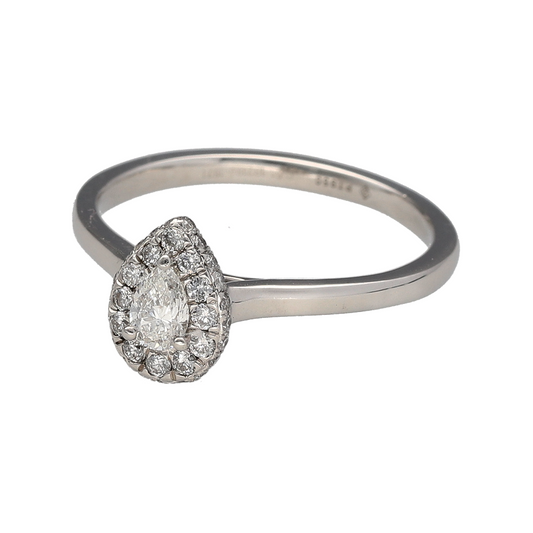 Add elegant sparkle and refined shape to your jewellery collection with this pre-owned platinum diamond teardrop halo ring, offering timeless design with a graceful and eye-catching profile.

Design: This ring features a teardrop-shaped centre diamond measuring approximately 0.23ct, framed by a brilliant cut diamond halo that enhances its shape and sparkle. The front of the ring measures approximately 10mm in height, creating a striking yet elegant presence.