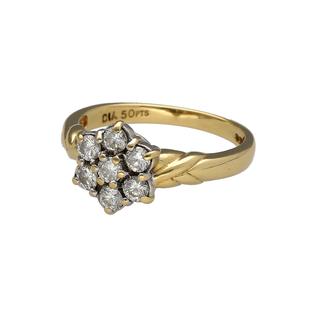 Add timeless sparkle to your jewellery collection with this pre-owned 18ct yellow gold diamond set flower cluster ring—an elegant design perfect for special occasions or everyday luxury.

Design: The ring features a beautiful flower cluster arrangement, with carefully positioned diamonds forming a floral-inspired silhouette. The clustered layout enhances brilliance across the head of the ring, creating the illusion of a larger centre presence while maintaining a soft, feminine shape.