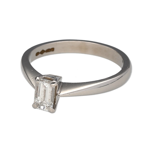 Add a refined and luxurious piece to your jewellery collection with this pre-owned platinum diamond set emerald cut solitaire ring, offering timeless elegance with a bold and sophisticated presence—perfect for special occasions or as a standout everyday piece.

Design: The ring features a classic solitaire design, showcasing an emerald cut diamond known for its clean lines and elegant, mirror-like facets.