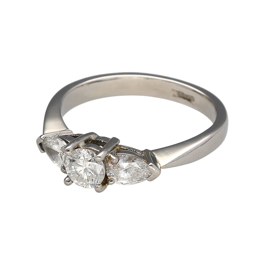 Add luxurious brilliance to your jewellery collection with this pre-owned platinum diamond trilogy ring, featuring an elegant combination of diamond cuts and timeless design—perfect for special occasions or everyday luxury.

Design: The ring showcases a brilliant-cut centre diamond of approximately 0.44ct, flanked by two pear-cut diamonds of approximately 0.25ct each, creating a striking and sophisticated three-stone arrangement.